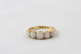 A Victorian 18ct gold and opal ring English, late 19th century, set with five graduated opals in a