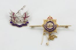 A 9ct white gold military gem set brooch modelled as the arms and motto for the Honourable Artillery
