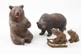 A Black Forrest bear inkwell German, late 19th century, modelled seated with open mouth, together