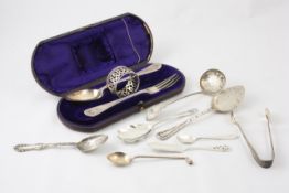 A small collection of assorted silver tableware comprising a Victorian spoon, fork and serviette