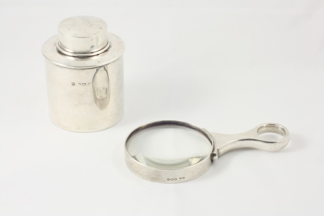 A silver tea caddy hallmarked Birmingham 1924/25, with makers mark for William Neale & Sons Ltd,