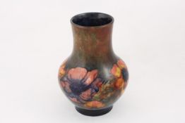 A Moorcroft `Anemone` vase circa 1935, decorated under a flambe glaze, with brown, green and blue