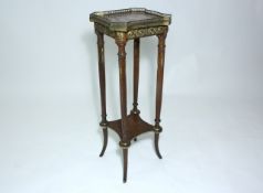 An early 20th century gilt metal mounted two tier stand French, the rouge marbled top with pierced