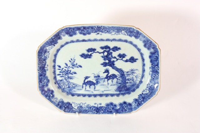 An 18th century Chinese export ware meat platter of shaped rectangular form, the central panel