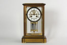 A brass mantel clock with twin tube mercury pendulum French, early 20th century, by D. C. & Cie,