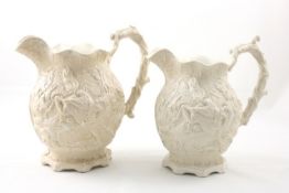 Two 19th century relief-moulded jugs English, late 19th century, of cream/beige colour decorated