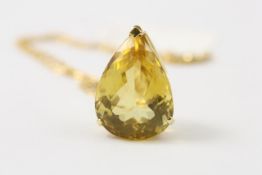 An 18ct gold pendant set with large faceted citrine probably 1960s, of tear drop form, on gold