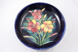 A Moorcroft `Fresia` circular bowl circa 1935, on blue ground, impressed factory mark, blue