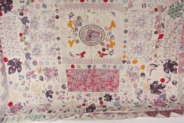 A large patchwork cover late 19th century, depicting flowers, leaves, birds etc, approx 224 x