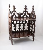 An oak gothic collapsible table top bookshelf third quarter 19th century, with fretted folding