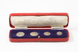 A cased set of George V Maundy Money 1935 in fair to good condition