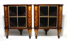 A pair of mid 19th century Dutch corner cabinets with floral marquetry inlay to the sides and