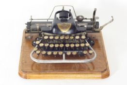 A Blick portable typewriter American, 1890s, with non-standard keyboard, indelible ink roller,