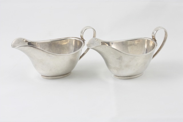 A pair of silver sauce boats hallmarked Chester 1933/34, with makers mark R&W.S for R & W Sorely,