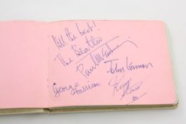 An autograph book with Beatles signatures all in the hand of Paul McCartney signed in blue biro,