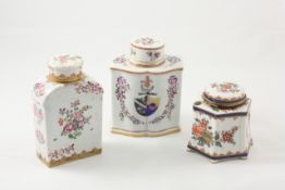 An 18th century Chinese export ware armorial tea caddy and cover enamelled with sprays of flowers