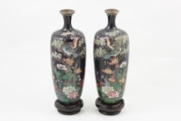 A pair of small late 19th century cloisonne enamel vases probably Chinese, each decorated with