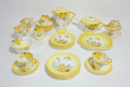 A Shelley `Phlox` pattern tea service 1920s/1930s, decorated with yellow phlox on a shaded yellow