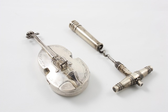 A white metal snuff box in the form of a cello Continental, late 19th century, the hinged case