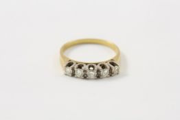 An 18ct gold five stone diamond ring probably 1960s, in horse shoe shaped setting In good overall