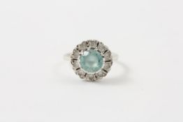 A 9ct white gold cluster ring probably 1950s, set with centre turquoise blue zircon with numerous
