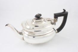 A silver teapot hallmarked Birmingham, 1945/46, with ebonised handle and finial, height 16cm Two