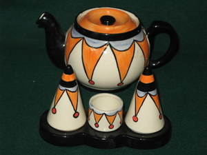 LORNA BAILEY CERAMIC CIRCUS TEAPOT AND THREE PIECE CRUET SET BY OLD ELLGREAVE POTTERY, BOTH SIGNED