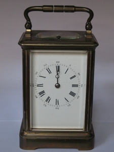 BRASS CARRIAGE CLOCK WITH ENAMELLED DIAL AND REPEATER BUTTON, STAMPED `VAD` TO BACK, APPROXIMATELY