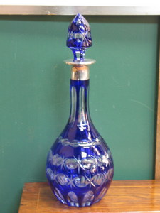 BLUE OVERLAID GLASS DECANTER WITH HALLMARKED SILVER MOUNT