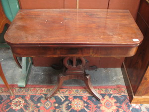 ANTIQUE MAHOGANY FOLD OVER TEA TABLE ON QUADRAFOIL SUPPORTS