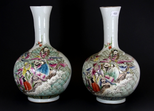 A pair of mid 20thC Canton enamelled porcelain vases with decoration of Imoratals.H.41cm