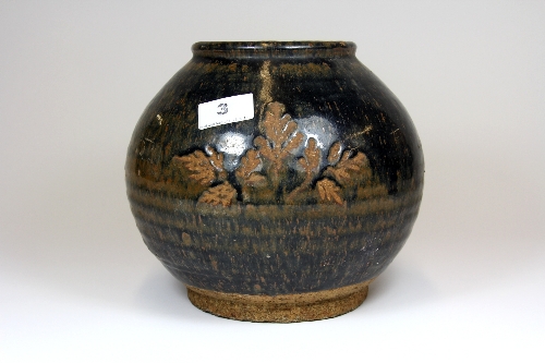 An interesting Song dynasty style brown glazed pottery jar with glazeless leaf design H.20cm Dia.