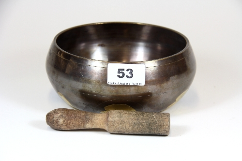 A Tibetan bronze singing bowl and wooden hammer Dia.16.5cm