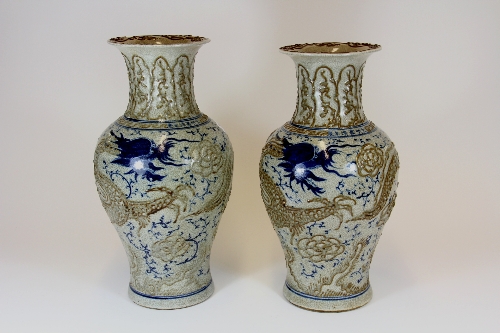 A pair of interesting Chinese crackle glazed hand painted and relief decorated stoneware vases H.