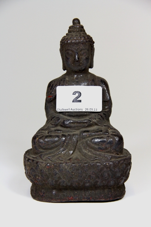 An early 20thC cast iron Buddha figure with remnants of colour H.14.5cm