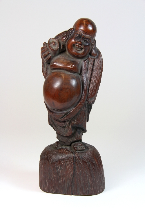 A Chinese carved hardwood figure of the Happy Buddha H.25cm