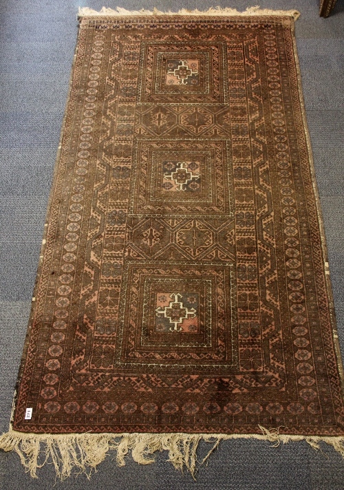 A 19thC hand woven Persian rug 223 x 119cm