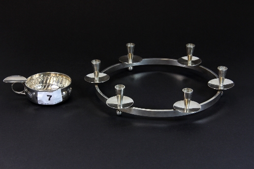 A Danish silver plated candle holder by E.Dragsted and a silver plated sommelier cup