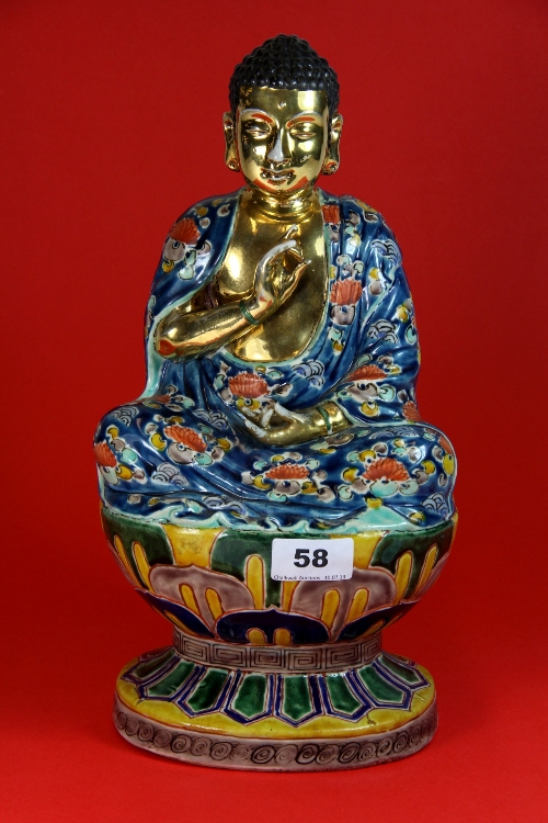 An early 20thC gilt and five colour enamelled porcelain figure of the seated Buddha a/f  H34cm
