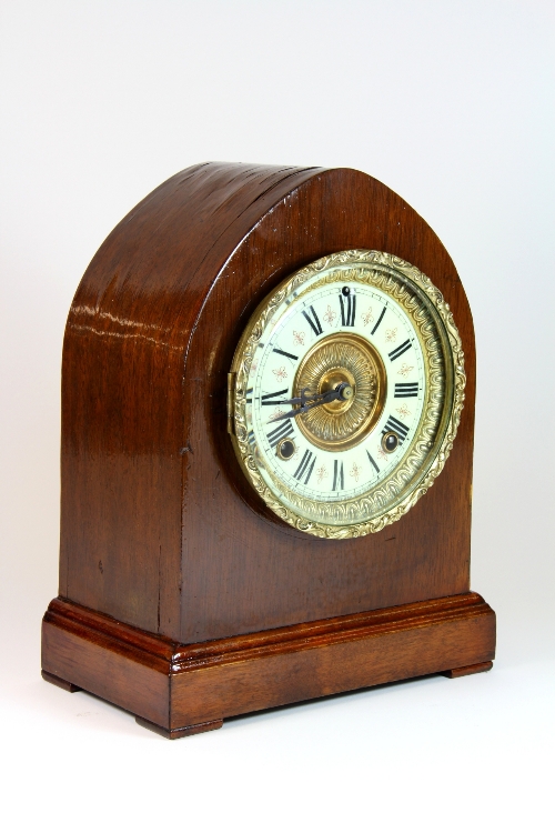 An early 20th century mahogany veneered Ansonia mantle clock recently serviced