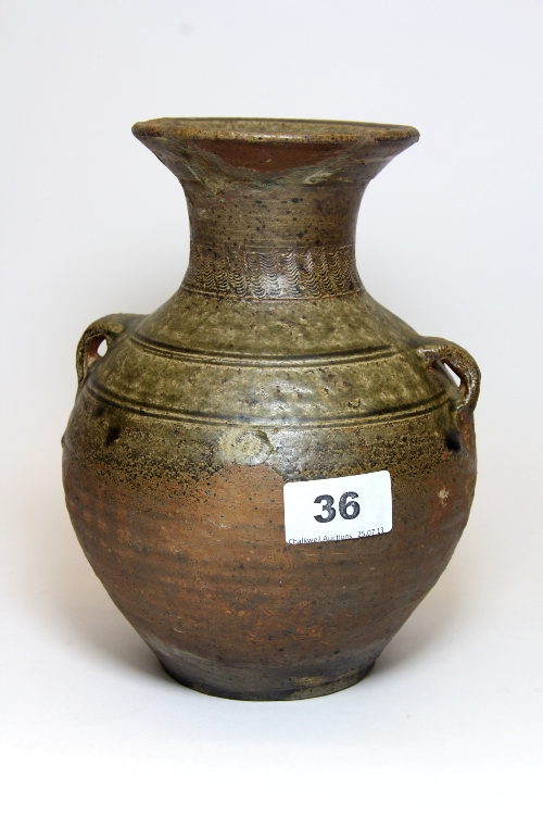 A Chinese Han Dynasty ( 206 BC - 210 AD ) pottery two handled vase with green glazed upper body and