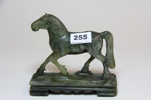 A carved jade/hardstone horse H.15cm L16cm