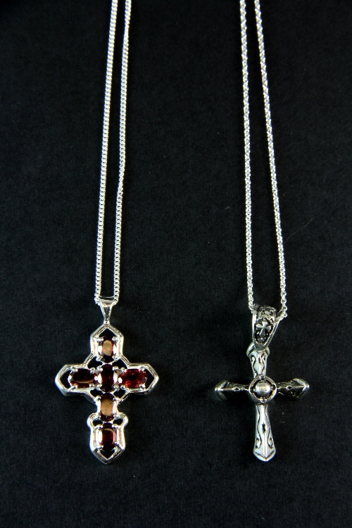 Two .925 silver crosses and chains.