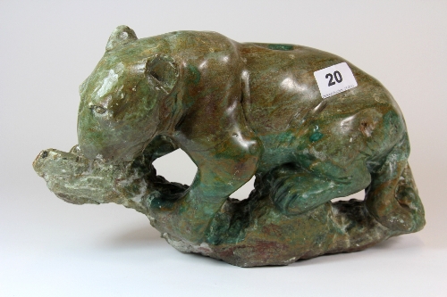 An unusual hand carved green stone big cat figure. H.20cm