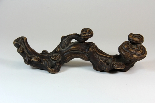 A Chinese 19th/20thC Yi Xing terracotta natural form brush rest. L.26cm H8.5cm