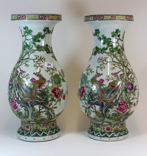 A superb pair of 19thC Chinese hand painted porcelain vases with decoration of phoenix in a floral