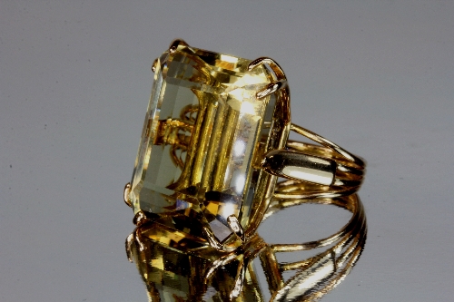 A yellow metal (tested minimum 9ct gold) ring set with a large citrine, size O.