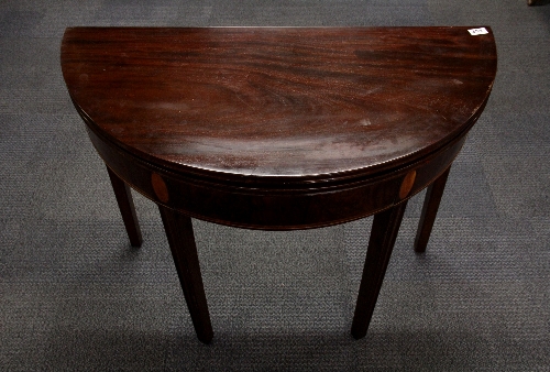 An inlaid Regency mahogany and mahogany veneered inlaid demi-lune folding tea table W91cm