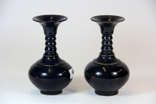 A pair of Chinese cobalt blue decorated mid 20thC vases H. 17cm with incised character marks to