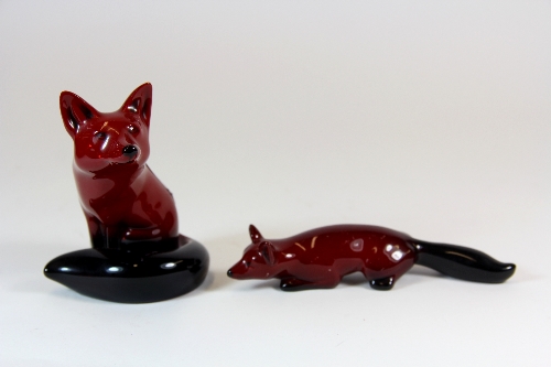 Two Royal Doulton Flambe foxes